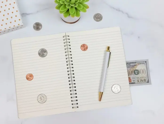 notebook and coins