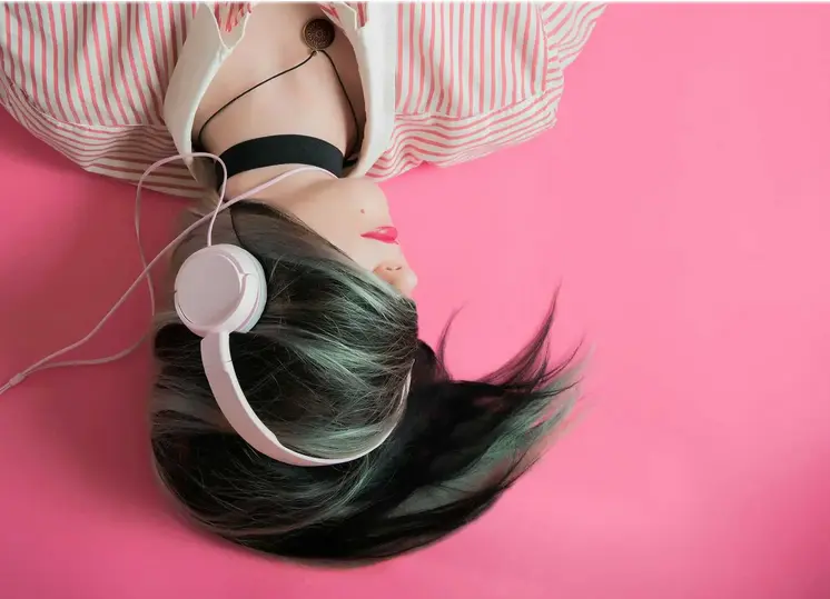woman listening music with headphones