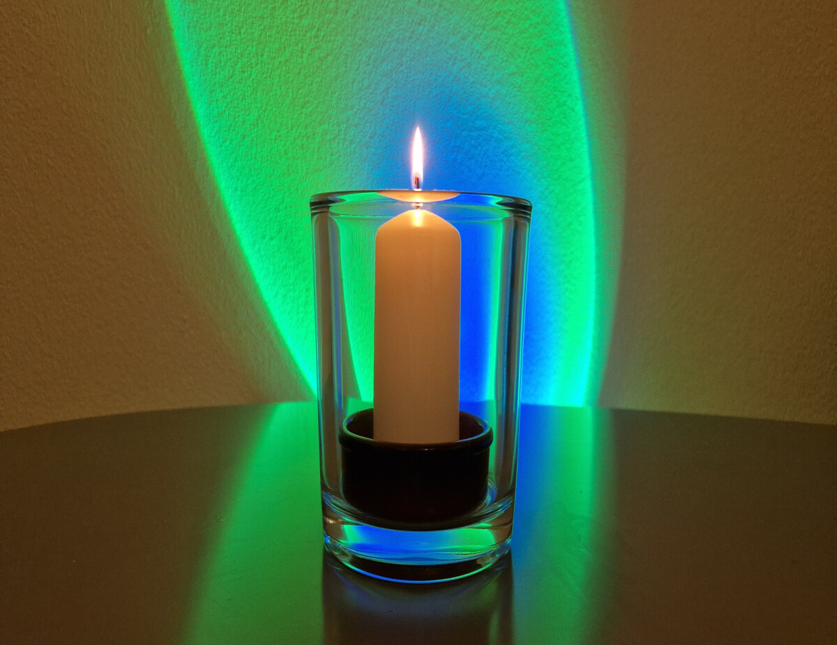 Candle and multicolor background light