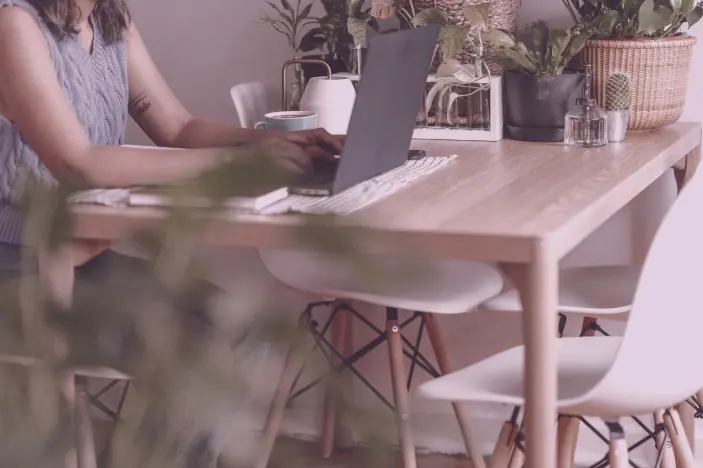 woman working on her laptop from home
