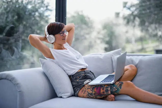 Woman on her coach listening to music