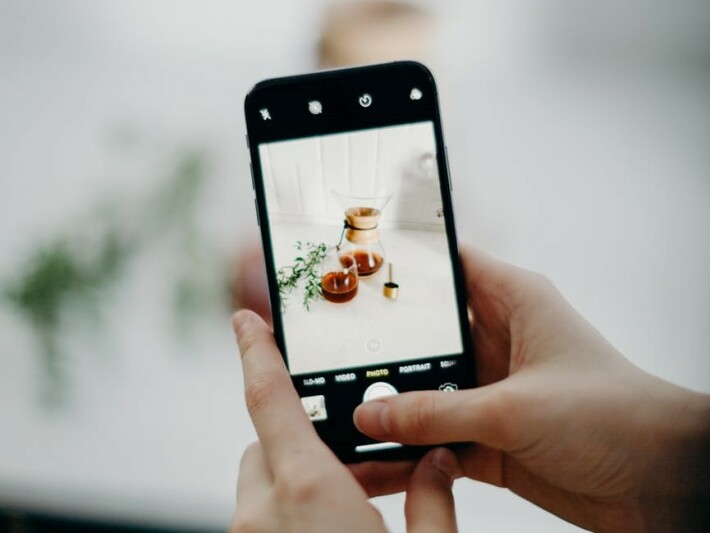 Person taking a photo with their phone