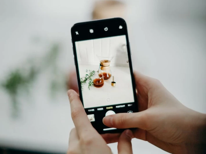 Person taking a photo with their phone